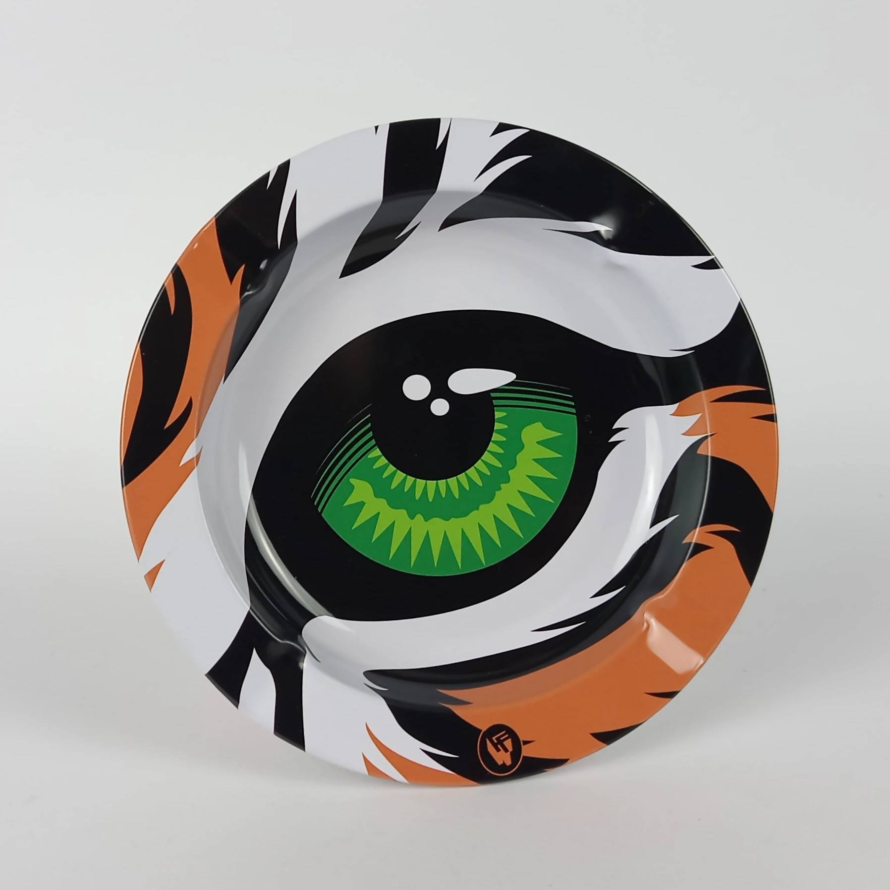 Fireflow Ashtray Eye of Tiger – durable metal ashtray featuring a bold green tiger eye design, perfect for any smoking setup or head shop collection.